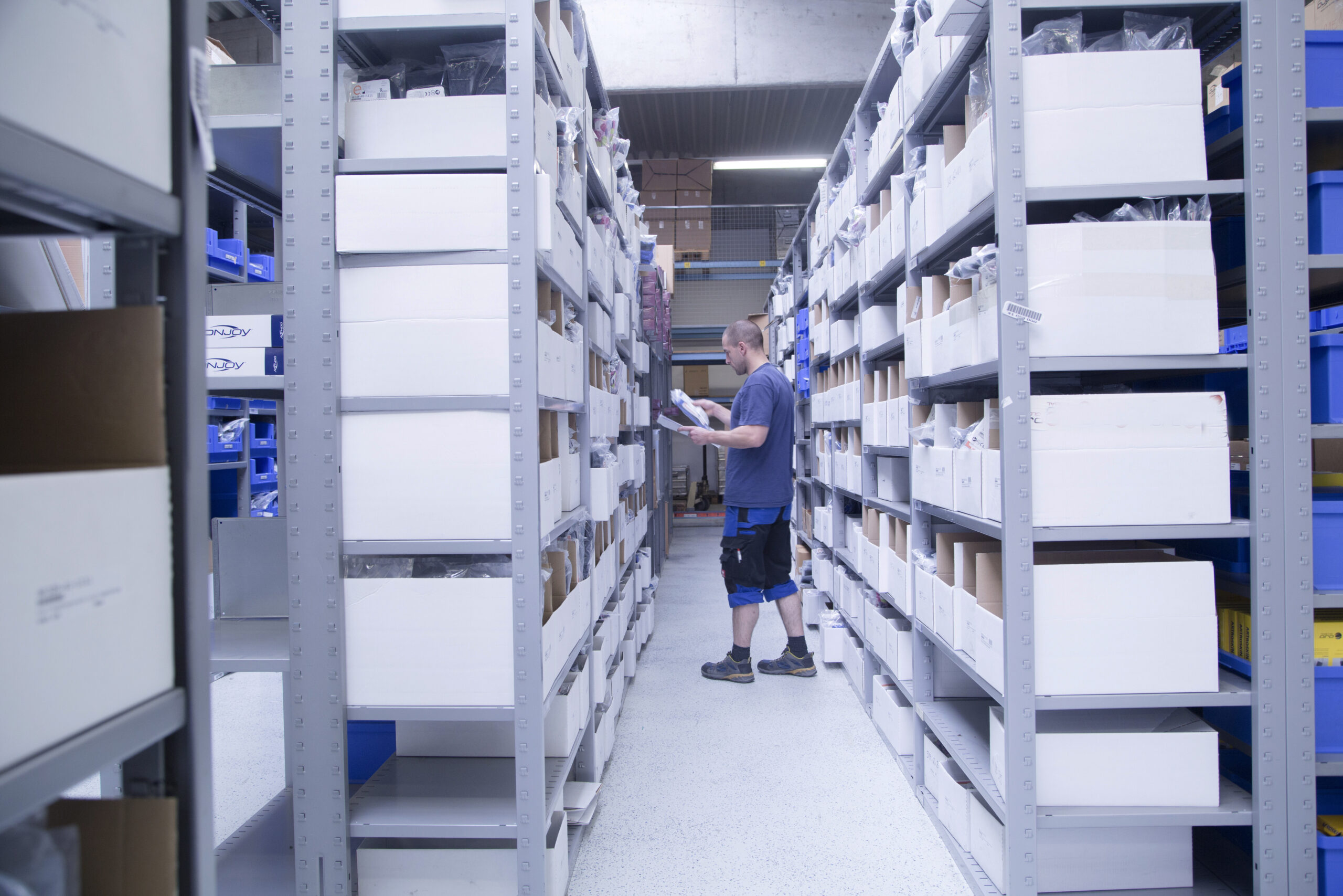 worker checking stocks at healthcare warehouse 2025 04 04 21 11 38 utc scaled